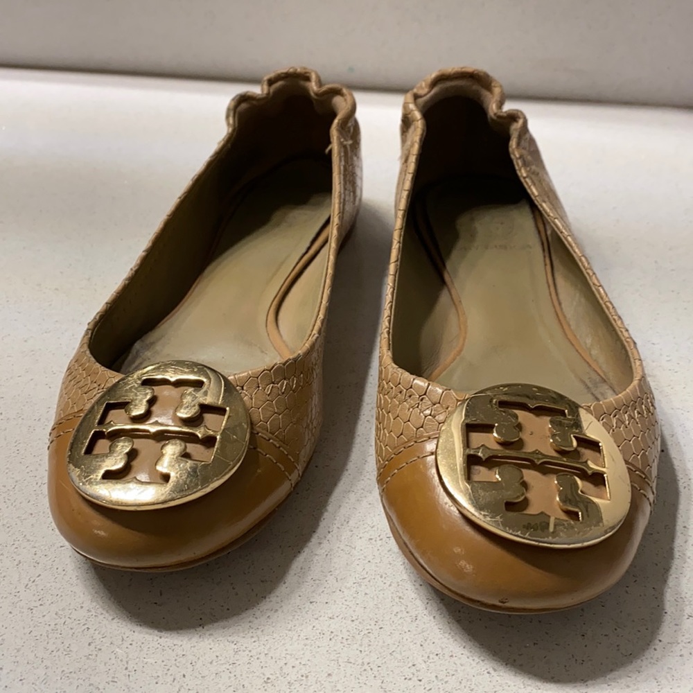 Tan Tory Burch flats with gold emblem